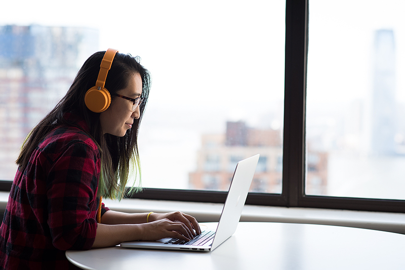 Girl with headphones in office